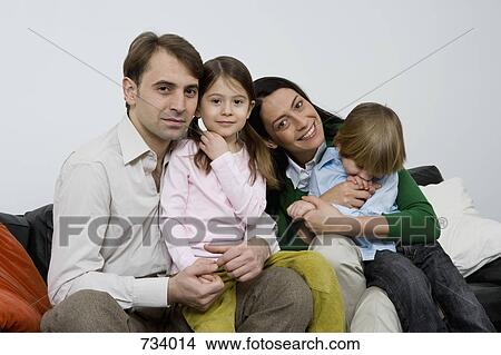 Portrait of a family of four View Large Photo Image Picture - Portrait of a family of four. Fotosearch