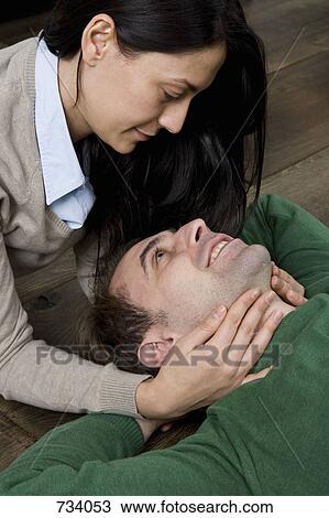 Stock Image - Portrait of a man and woman being affectionate. Fotosearch