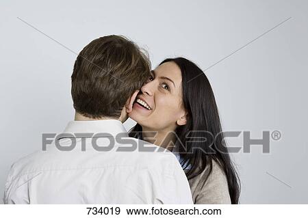 Portrait of a man and woman being affectionate View Large Photo Image Stock Photo - Portrait of a man and woman being affectionate. Fotosearch