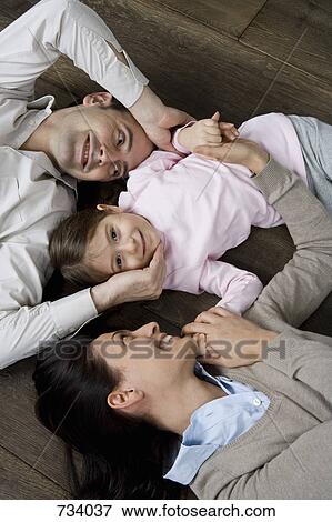 Portrait of two parents and their child View Large Photo Image Stock Photo - Portrait of two parents and their child. Fotosearch