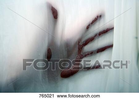 Stock Image - A hand pressing against a shower curtain. Fotosearch