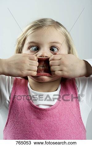 A little girl making a scary face View Large Photo Image Stock Image - A little girl making a scary face. Fotosearch