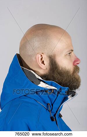 Stock Image - A man in a ski jacket, profile. Fotosearch