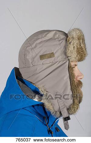 Stock Photo - A man wearing warm clothing, profile. Fotosearch