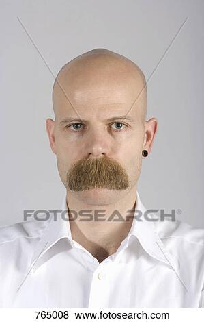 Stock Photo - A man with long mustache hair covering his mouth. Fotosearch