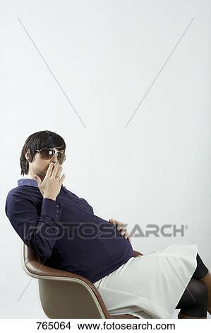 A pregnant woman smoking View Large Photo Image Picture - A pregnant woman smoking. Fotosearch