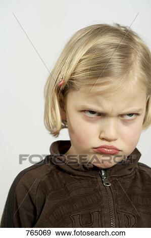 A young girl making an angry face View Large Photo Image Stock Photo - A young girl making an angry face. Fotosearch