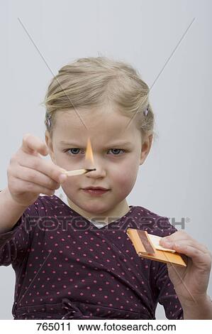 A young girl playing with matches View Large Photo Image Stock Image - A young girl playing with matches. Fotosearch