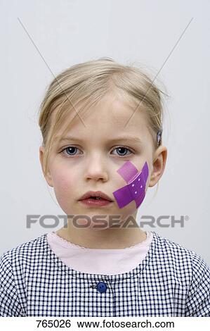 A young girl with a adhesive bandage on her cheek View Large Photo Image Stock Photograph - A young girl with a adhesive bandage on her cheek. Fotosearch