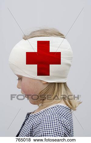 Stock Photo - A young girl with a head injury. Fotosearch