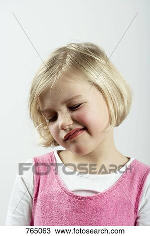 Stock Image - A young girl with a skeptical look. Fotosearch
