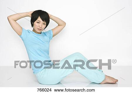 Picture - A woman doing exercises. Fotosearch