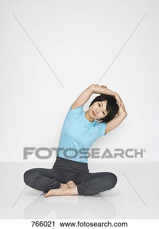 A woman doing exercises View Large Photo Image Stock Image - A woman doing exercises. Fotosearch