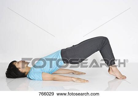 A woman doing exercises View Large Photo Image Stock Photo - A woman doing exercises. Fotosearch