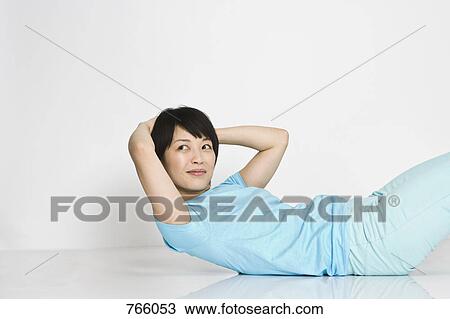 A woman exercising View Large Photo Image Stock Image - A woman exercising. Fotosearch