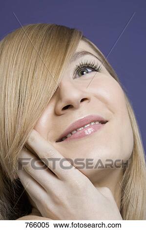 Headshot of a young woman View Large Photo Image Stock Photography - Headshot of a young woman. Fotosearch