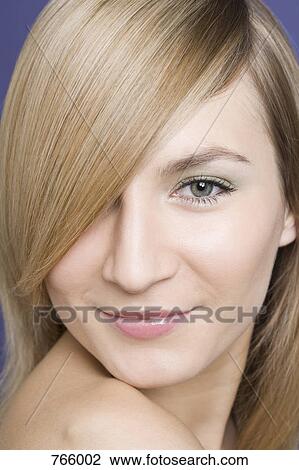 Headshot of a young woman with blond hair View Large Photo Image Stock Image - Headshot of a young woman with blond hair. Fotosearch
