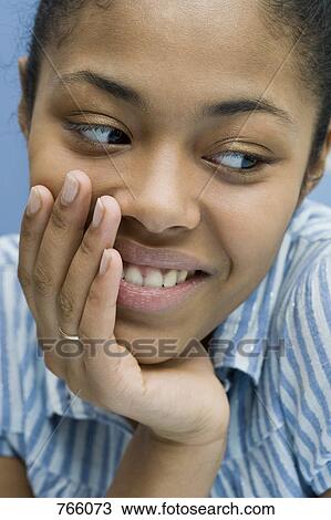 Portrait of a young woman smiling View Large Photo Image Stock Image - Portrait of a young woman smiling. Fotosearch