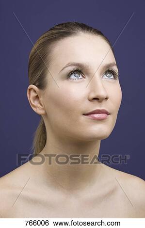 Portrait of a young woman with hair back View Large Photo Image Stock Photograph - Portrait of a young woman with hair back. Fotosearch