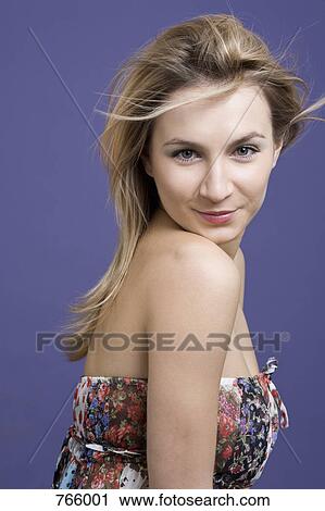 Young woman with blond hair smiling View Large Photo Image Stock Image - Young woman with blond hair smiling. Fotosearch