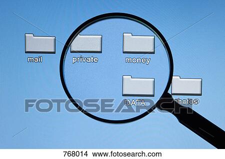 A magnifying glass in front of a computer screen View Large Photo Image Picture - A magnifying glass in front of a computer screen. Fotosearch