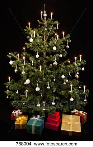 Gifts underneath a Christmas Tree View Large Photo Image Picture - Gifts underneath a Christmas Tree. Fotosearch
