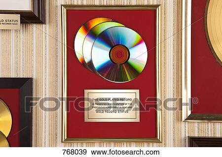 Stock Photo - Gold compact disc award. Fotosearch
