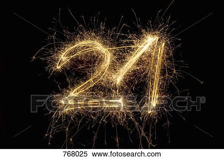 Stock Photography - The number 21 written with a sparkler. Fotosearch