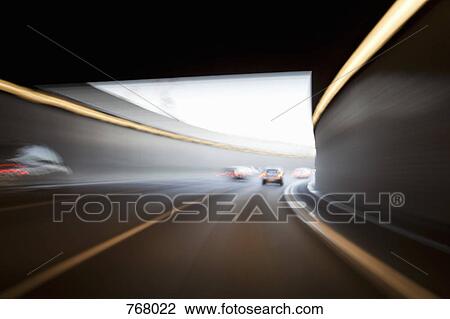 Traffic driving through a tunnel View Large Photo Image Stock Image - Traffic driving through a tunnel. Fotosearch