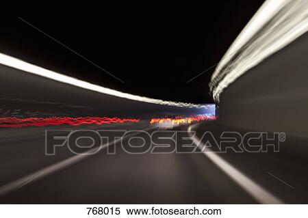 Stock Photography - Traffic driving through a tunnel. Fotosearch