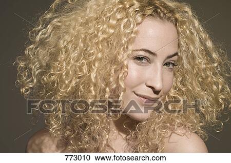 Beauty shot of a woman looking coy View Large Photo Image Stock Image - Beauty shot of a woman looking coy. Fotosearch