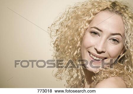 Beauty shot of a woman smiling happily View Large Photo Image Stock Photo - Beauty shot of a woman smiling happily. Fotosearch