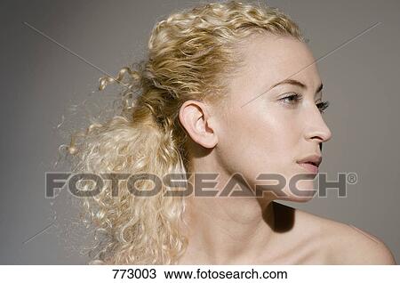 Stock Image - Beauty shot of a woman staring off to the side. Fotosearch