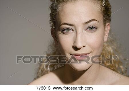Beauty shot of a woman with her eyebrow raised View Large Photo Image Stock Image - Beauty shot of a woman with her eyebrow raised. Fotosearch