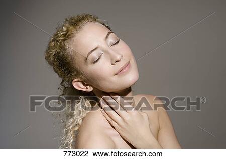 Beauty shot of a woman with her eyes closed View Large Photo Image Stock Image - Beauty shot of a woman with her eyes closed. Fotosearch