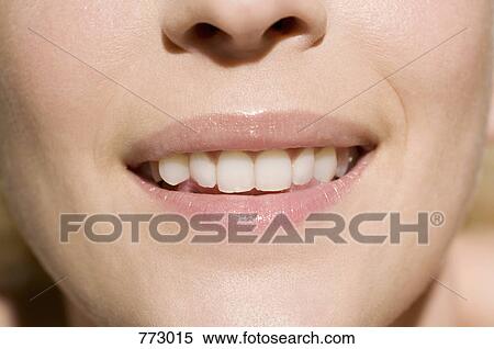 Extreme close-up of a woman's mouth View Large Photo Image Stock Photography - Extreme close-up of a woman's mouth. Fotosearch