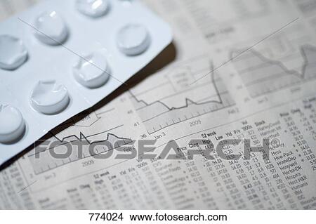 A financial page and a blister pack View Large Photo Image Picture - A financial page and a blister pack. Fotosearch