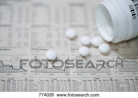 A financial page with a bottle of pills spilled on it View Large Photo Image Stock Photograph - A financial page with a bottle of pills spilled on it. Fotosearch