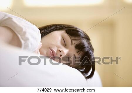 A teenage girl sleeping View Large Photo Image Stock Photo - A teenage girl sleeping. Fotosearch