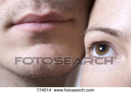 Extreme close-up of a woman's eye and man's lips View Large Photo Image Picture - Extreme close-up of a woman's eye and man's lips. Fotosearch