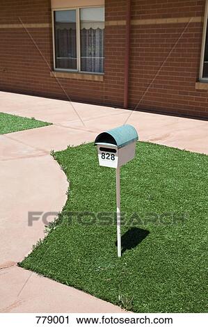 A postbox on a lawn outside of a house View Large Photo Image Stock Image - A postbox on a lawn outside of a house. Fotosearch
