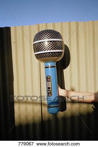 An oversized microphone View Large Photo Image Stock Photo - An oversized microphone. Fotosearch