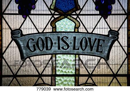 Stock Photo - God Is Love written in a stained glass window. Fotosearch