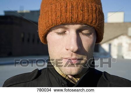 A man with a knit hat, portrait View Large Photo Image Picture - A man with a knit hat, portrait. Fotosearch