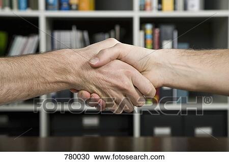 The hands of two men shaking View Large Photo Image Stock Image - The hands of two men shaking. Fotosearch