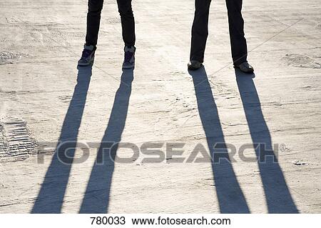 The legs of two people View Large Photo Image Stock Image - The legs of two people. Fotosearch