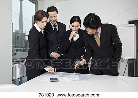 Four business people in a business meeting View Large Photo Image Stock Image - Four business people in a business meeting. Fotosearch