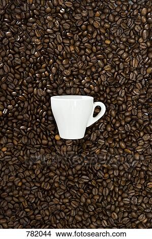 An espresso cup and coffee beans View Large Photo Image Picture - An espresso cup and coffee beans. Fotosearch