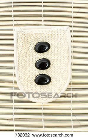 hot stone therapy stones on a loofah View Large Photo Image Stock Image - hot stone therapy stones on a loofah. Fotosearch