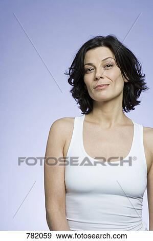 Portrait of a woman wearing a white top View Large Photo Image Stock Photo - Portrait of a woman wearing a white top. Fotosearch
